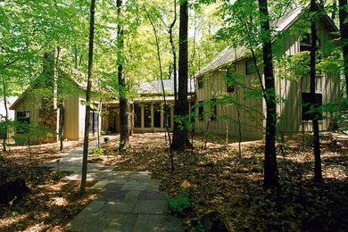 Example of a trendy gray two-story wood exterior home design in DC Metro