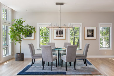 Transitional light wood floor and beige floor dining room photo in Boston with beige walls