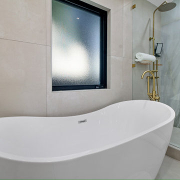 Soaking Tub Beside an Obscured Glass Window