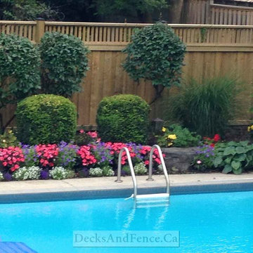 Pool deck with privacy fence