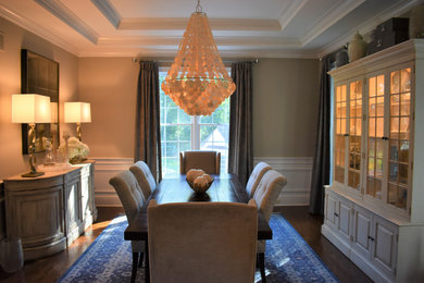 Inspiration for a mid-sized timeless dark wood floor kitchen/dining room combo remodel in New York with beige walls