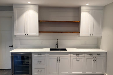 Example of a home bar design in Other