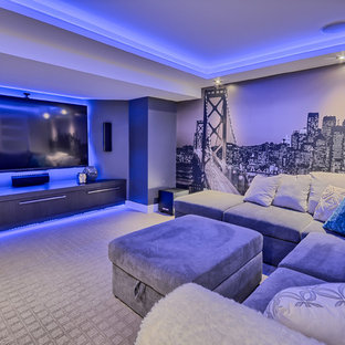 Inspiration for a contemporary enclosed carpeted and gray floor home theater remodel in Montreal with gray walls and a wall-mounted tv