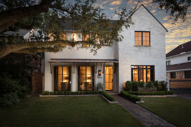 Example of a large transitional white two-story exterior home design in Houston