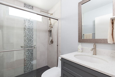 Bathroom - small contemporary kids' gray tile and ceramic tile porcelain tile and gray floor bathroom idea in San Diego with shaker cabinets, gray cabinets, an undermount sink and quartz countertops