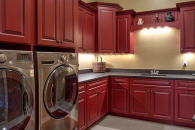 Example of a classic laundry room design in Other