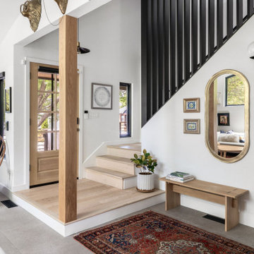 Entry with staircase, oval mirror — Nixon I, Reno interior design by Find Design