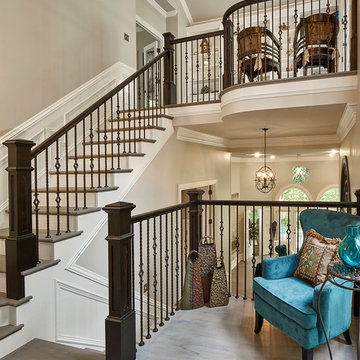 Staircase with gray stained hardwoods, new spindles and paint