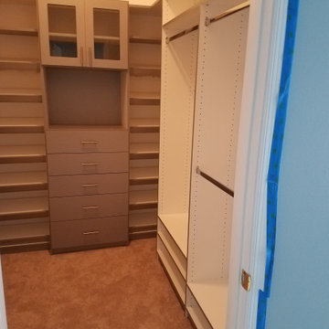 White and Grey Walk-in Closet w/ Glass Cabinets - Waldorf, MD