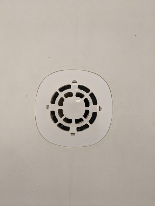 Shower drains directly to 2” PVC pipe beneath loose drain cover