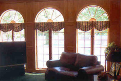 Example of an open concept family room design in New York with a tv stand