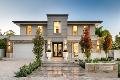Inspiration for a transitional two-storey beige exterior in Perth with mixed siding and a flat roof.