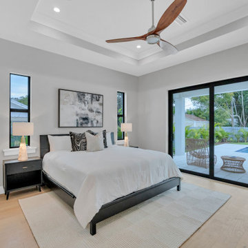 Contemporary Primary Bedroom with Patio Access — East of the Trail Sarasota