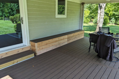 Deck - small contemporary side yard ground level deck idea in Cincinnati with a roof extension