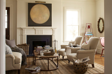 This is an example of a transitional formal enclosed living room in New York with a standard fireplace.