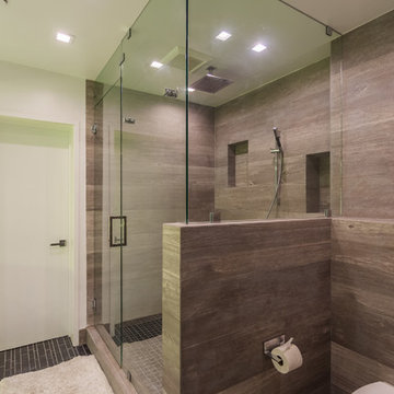 Wood Look Tile Shower With Half-Wall Toilet Divider