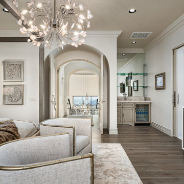 Bedroom with Arched Double Doors and Wet Bar