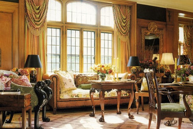 Example of a huge classic formal dark wood floor living room design in Chicago with green walls