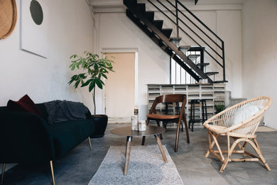 Living room - rustic concrete floor, gray floor and wood ceiling living room idea in Other with a bar
