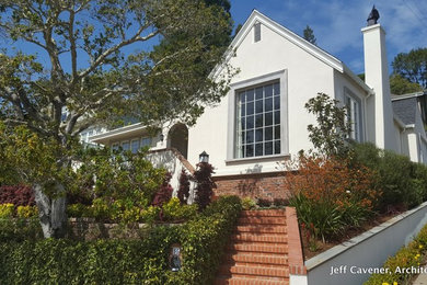 Mid-sized craftsman gray split-level stucco exterior home idea in San Francisco with a shingle roof