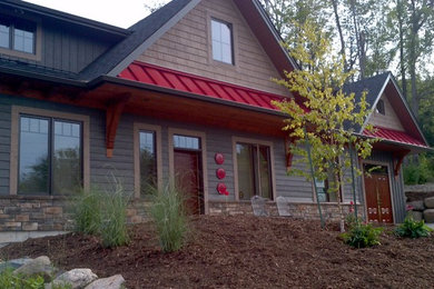 Inspiration for a mid-sized country gray two-story mixed siding gable roof remodel in Toronto