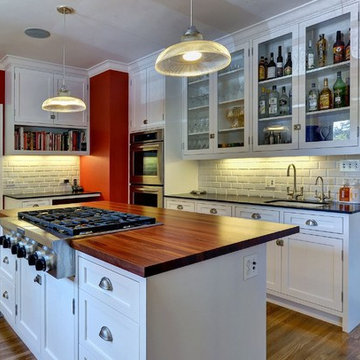 Delightful Contemporary Kitchen with Wood Island Top by DeVos Woodworking