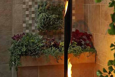 Inspiration for a mid-sized contemporary terra-cotta tile foyer remodel in Toronto with beige walls