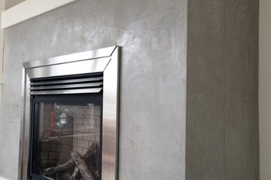 Hand-trowelled polished concrete fireplace finish.