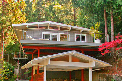 Large modern gray two-story vinyl gable roof idea in San Francisco