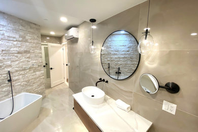 Example of a large tuscan master beige tile and porcelain tile porcelain tile, beige floor and single-sink bathroom design in Detroit with flat-panel cabinets, medium tone wood cabinets, a two-piece toilet, beige walls, a vessel sink, quartz countertops, white countertops and a floating vanity