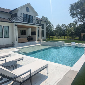 Lewes, DE - Modern, Clean Line Pool with Large Tanning Ledge & Elevated Spa
