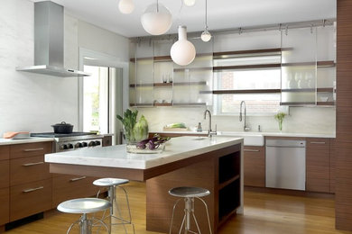 Trendy u-shaped eat-in kitchen photo in St Louis with a farmhouse sink, medium tone wood cabinets, marble countertops, stone slab backsplash and stainless steel appliances