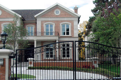 Example of a transitional exterior home design in Toronto