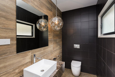 Design ideas for a bathroom in Wollongong with concrete floors.
