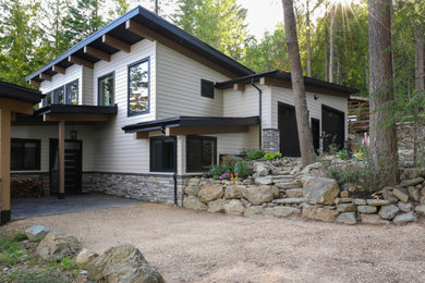 Example of a large trendy two-story house exterior design in Vancouver