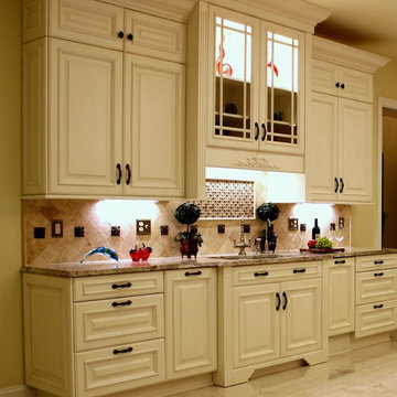 Luxurious Kitchen w/Antique White Cabinetry & Sienna Bordeaux Granite Countertop
