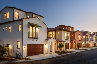 Inspiration for a large craftsman three-story stucco exterior home remodel in Santa Barbara