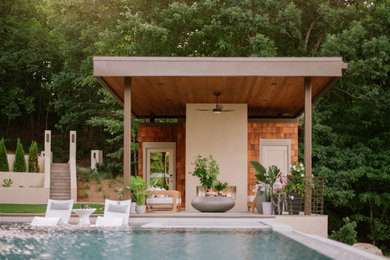 Mid-sized modern one-story wood and shingle flat roof idea in Atlanta with a metal roof