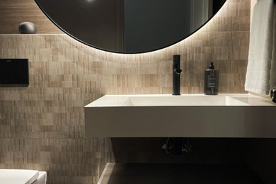 Example of a minimalist powder room design in Toronto