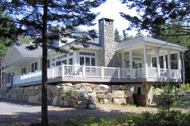 Mid-sized elegant yellow two-story vinyl house exterior photo in Boston with a hip roof and a shingle roof