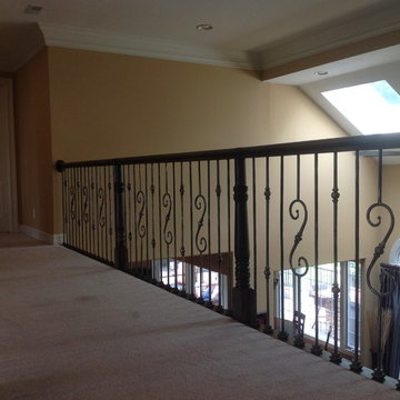 Stairway Renovation - Wood Railing and Satin Clear Iron Balusters