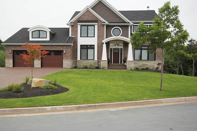 Traditional two-story wood exterior home idea in Other