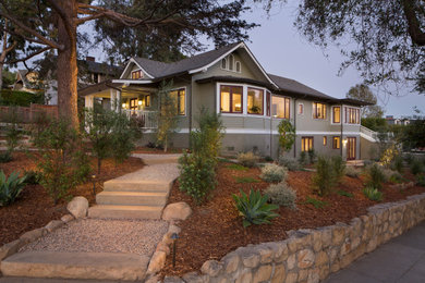 Mid-sized arts and crafts green two-story mixed siding and clapboard exterior home photo in Santa Barbara with a shingle roof and a black roof
