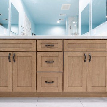 Coastal Modern Bathroom Remodel with Light Oak Vanity and Walk-In Glass Shower
