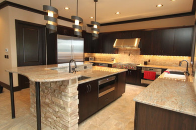 Large transitional u-shaped travertine floor kitchen pantry photo in DC Metro with an undermount sink, flat-panel cabinets, dark wood cabinets, limestone countertops, beige backsplash, stone tile backsplash, stainless steel appliances and an island