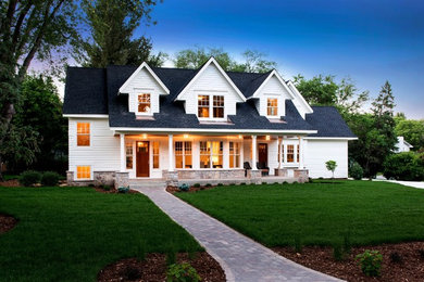 Mid-sized white three-story gable roof photo in Minneapolis