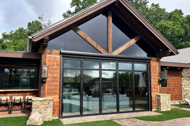 Example of a mid-sized mountain style brown one-story wood and shingle gable roof design in Nashville with a shingle roof and a brown roof