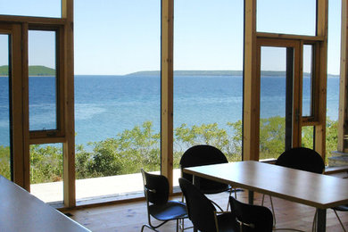 Example of a minimalist dining room design in Toronto