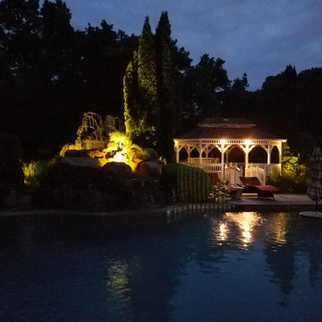 Lighting makes for a powerful statement on this gorgeous home and pool