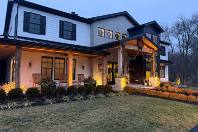 Example of a farmhouse exterior home design in Philadelphia